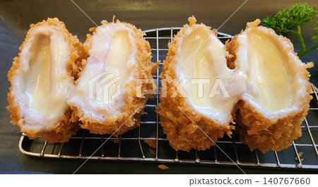 Deep Fried Pork Cutlet Stuffed with Melted Cheese Japanese Tonkatsu Style Deep Fried Pork Cutlet Stuffed with Melted Cheese Japanese Tonkatsu Style 140767660