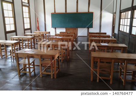 Memories of school. A nostalgic scene of the retro classrooms and wooden desks of the former Fukiya Elementary School. Memories of school. A nostalgic scene of the retro classrooms and wooden desks of the former Fukiya Elementary School. 140768477