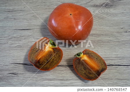 The rare Kinokawa persimmon with black flesh. The rare Kinokawa persimmon with black flesh. 140768547