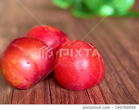 Bright red plum Bright red plum 140768698