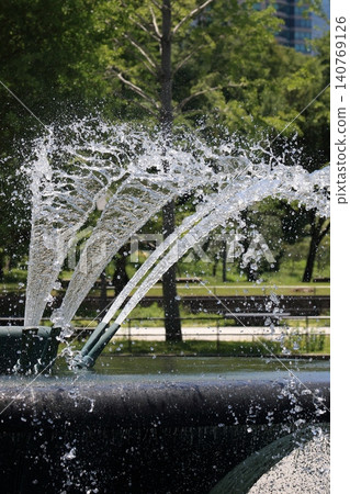 Scenery with a fountain: Water gushing out with force Scenery with a fountain: Water gushing out with force 140769126