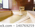 A family bath with a cypress wood tub and still life photographs of the hot spring. 140769259