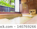A family bath with a cypress wood tub and still life photographs of the hot spring. 140769266