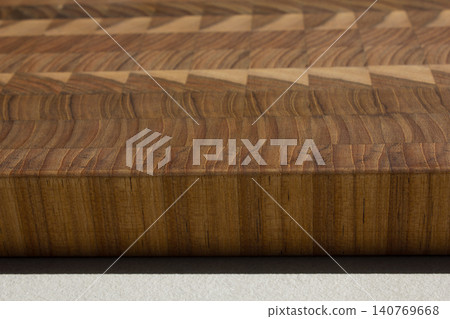 This is a patterned wooden cutting board. This is a patterned wooden cutting board. 140769668