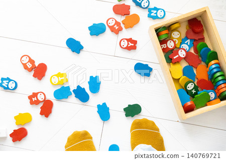 Colorful dominoes scattered on a white floor Colorful dominoes scattered on a white floor 140769721