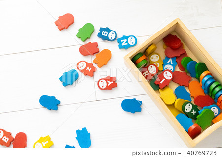 Colorful dominoes scattered on a white floor 140769723