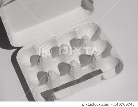 It is an empty paper egg carton. It is an empty paper egg carton. 140769745