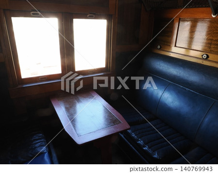 Wooden box seats at the Sulfide Street Railroad History Museum—a nostalgic atmosphere of travel illuminated by soft light. Wooden box seats at the Sulfide Street Railroad History Museum—a nostalgic atmosphere of travel illuminated by soft light. 140769943