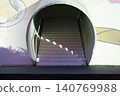 Modern architectural staircase with a circular entrance 140769988