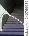 Modern architectural staircase with a circular entrance 140769989