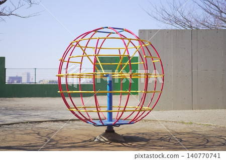 Old-fashioned spinning playground equipment 140770741