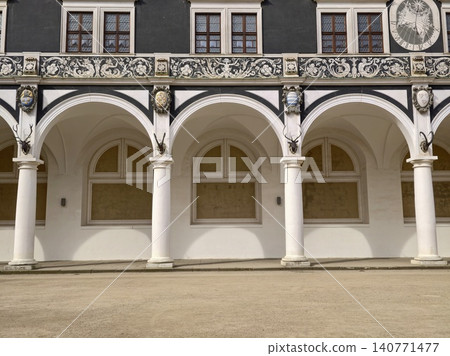 Elegant historic architecture. Charming heritage space with rhythmic arches and peaceful ambiance Elegant historic architecture. Charming heritage space with rhythmic arches and peaceful ambiance 140771477