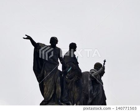 Classical figures contrast with cloudy sky. Bronze and marble statues evoke civic pride and history Classical figures contrast with cloudy sky. Bronze and marble statues evoke civic pride and history 140771503