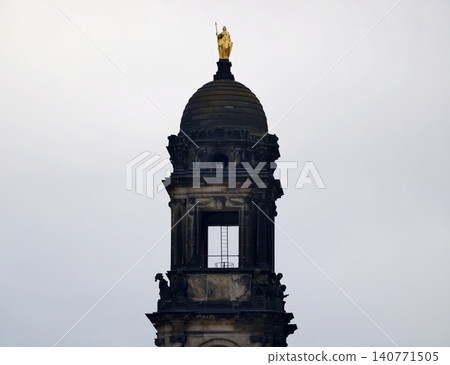 Ancient building features. Architectural monument emphasizing historic artistry and weathered textures Ancient building features. Architectural monument emphasizing historic artistry and weathered textures 140771505