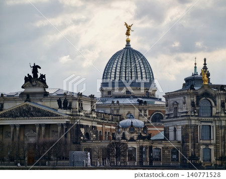 Majestic domed museum adorned with gilded angel and intricate sculptural rooftop embellishments Majestic domed museum adorned with gilded angel and intricate sculptural rooftop embellishments 140771528