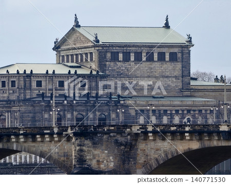 Ancient stone bridge with textured surfaces over calm reflective river creates timeless cityscape Ancient stone bridge with textured surfaces over calm reflective river creates timeless cityscape 140771530