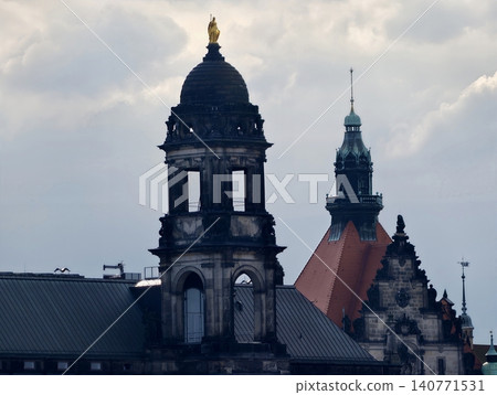 Student artist depicts dome and spire with elaborate architectural features beneath stormy skies Student artist depicts dome and spire with elaborate architectural features beneath stormy skies 140771531