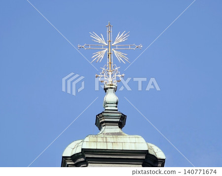 Elegant dome ornament. Decorative copper dome top featuring intricate star finial with verdigris 140771674