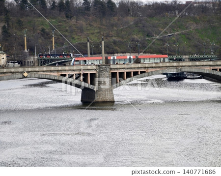 Vibrant urban transit. Industrial daytime scene with flowing river and bustling infrastructure Vibrant urban transit. Industrial daytime scene with flowing river and bustling infrastructure 140771686
