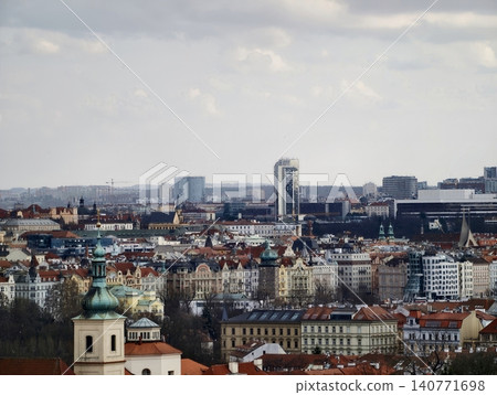 Bustling city horizon with sleek towers and layered red roofs highlighting architectural contrast 140771698