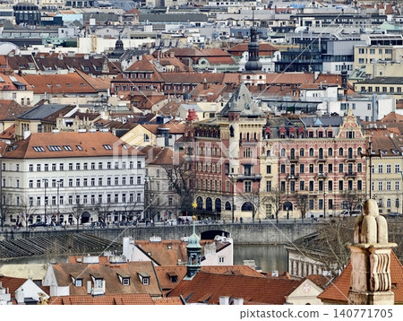 Historic city sight. Gothic structures with lively crowds and scenic waterside scenery for tourism Historic city sight. Gothic structures with lively crowds and scenic waterside scenery for tourism 140771705