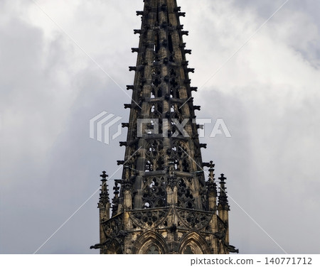 Gothic tower grandeur. Vertical gothic architecture showcasing historic artistry and elaborate tracery 140771712