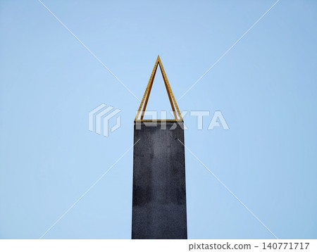 Architectural landmark showcasing clean modern lines and textured metal finishing against clear sky Architectural landmark showcasing clean modern lines and textured metal finishing against clear sky 140771717