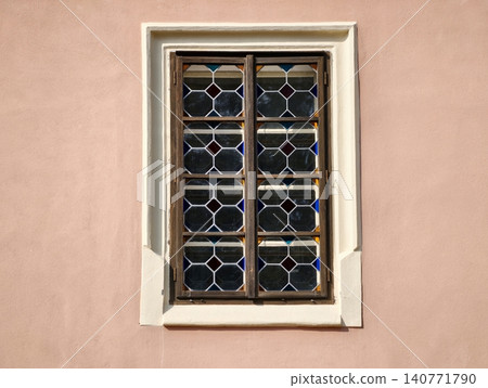 Charmingly aged glass craftsmanship featuring complex leaded motifs and subtle wall imperfections Charmingly aged glass craftsmanship featuring complex leaded motifs and subtle wall imperfections 140771790