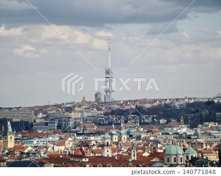 Media tower stands against cloudy skyline. Iconic tower shapes urban visual narrative today Media tower stands against cloudy skyline. Iconic tower shapes urban visual narrative today 140771848