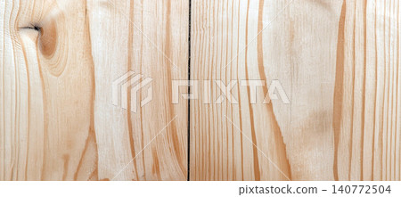 A light-colored natural pine wood texture background with a vertical grain pattern. A light-colored natural pine wood texture background with a vertical grain pattern. 140772504