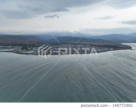 <Bird's-eye view> The calm sea and the town of Mashike as seen from the Sea of Japan <Bird's-eye view> The calm sea and the town of Mashike as seen from the Sea of Japan 140772902