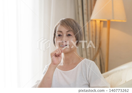Senior woman brushing teeth Senior woman brushing teeth 140773262