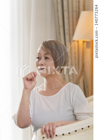 Senior woman brushing teeth Senior woman brushing teeth 140773264