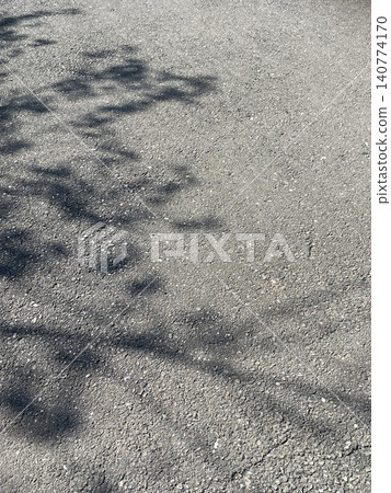 The shadow of a tree on asphalt The shadow of a tree on asphalt 140774170