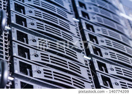 Cluster of data storage hard drives inside server room Cluster of data storage hard drives inside server room 140774209