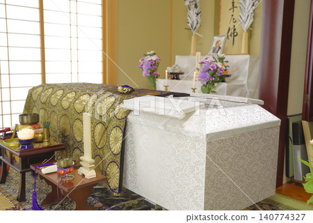 A white coffin placed in front of the altar in the Japanese-style room. A white coffin placed in front of the altar in the Japanese-style room. 140774327