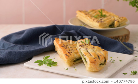 Spinach puff pastry with ricotta cheese Spinach puff pastry with ricotta cheese 140774796