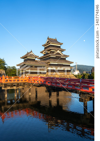 Matsumoto Castle and red bridge at sunset, Japan 140774846