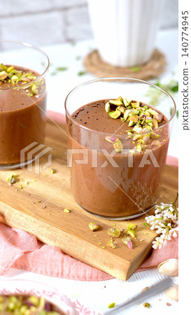 Elegant glasses of chocolate mousse with pistachios 140774945
