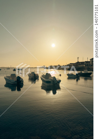 Boats Anchored at Cais de Sao Jacinto Pier in Aveiro Portugal at Sunset Boats Anchored at Cais de Sao Jacinto Pier in Aveiro Portugal at Sunset 140775101