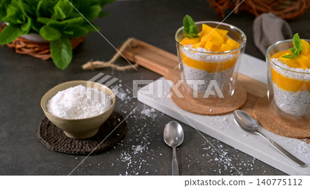 Healthy Chia Seed Pudding with Mango and Shredded Coconut in Glass Cups Healthy Chia Seed Pudding with Mango and Shredded Coconut in Glass Cups 140775112