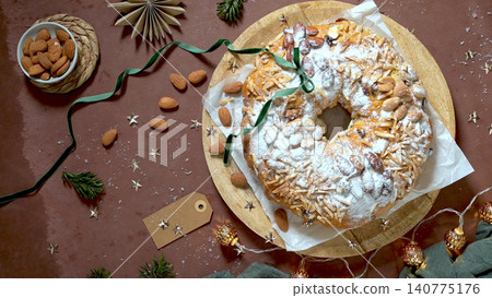 Traditional Christmas Bolo Rei Fruit Cake with Toasted Almonds and Powdered Sugar Traditional Christmas Bolo Rei Fruit Cake with Toasted Almonds and Powdered Sugar 140775176