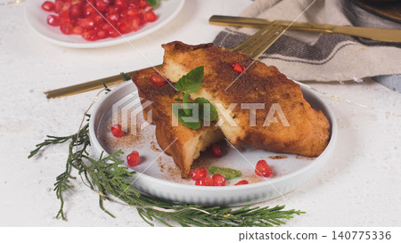 Sweet French toast slices sprinkled with cinnamon and sugar Sweet French toast slices sprinkled with cinnamon and sugar 140775336