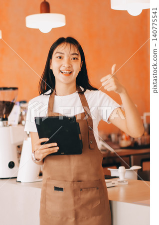 Young woman at barista school learning how to make espresso coffee. Young woman at barista school learning how to make espresso coffee. 140775541