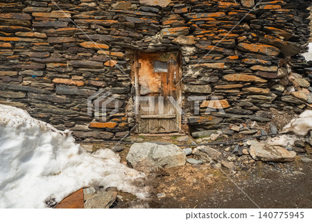 A weathered wooden door, likely a stock image of a village house A weathered wooden door, likely a stock image of a village house 140775945