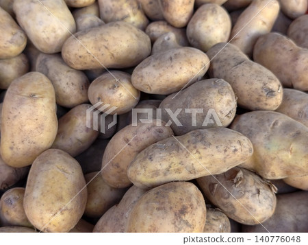 Full frame of fresh raw potatoes texture background Full frame of fresh raw potatoes texture background 140776048