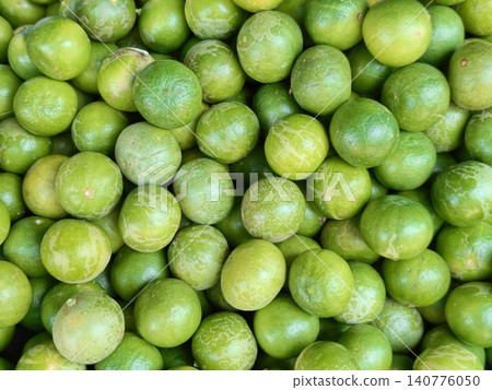 Full frame of fresh green limes texture background Full frame of fresh green limes texture background 140776050