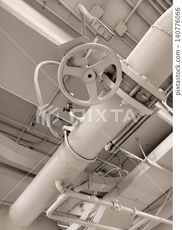 Industrial pipe network with valve and pressure gauge on ceiling Industrial pipe network with valve and pressure gauge on ceiling 140776066