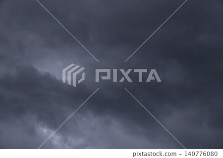 Dramatic dark storm clouds filling the sky, ominous cloudy weather background before rain. Dramatic dark storm clouds filling the sky, ominous cloudy weather background before rain. 140776080
