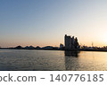 The port and silos of the Takasago Industrial Zone, bathed in the setting sun (Takasago City, Hyogo Prefecture) 140776185